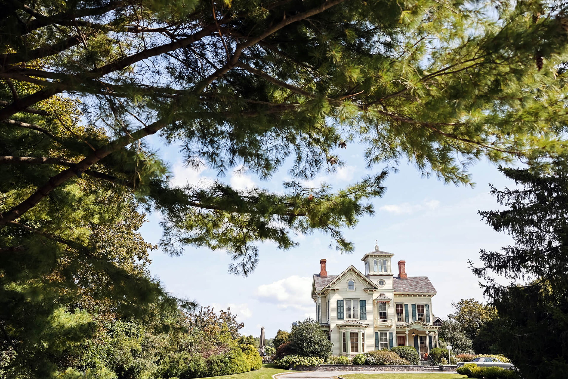 Jedediah Hawkins Inn framed by trees - 3 Elements Photography-